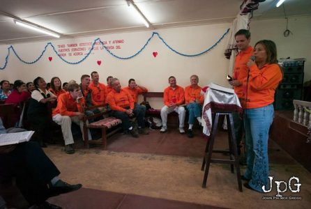 People in orange shirts.